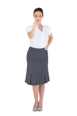 Stylish businesswoman on white background pointing の写真素材
