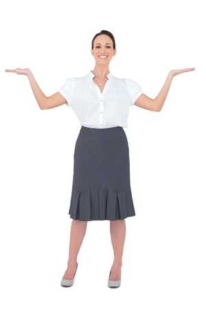 Happy gorgeous businesswoman posing on white background の写真素材