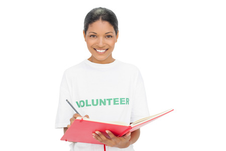 Happy model wearing volunteer tshirt on white background writingの写真素材