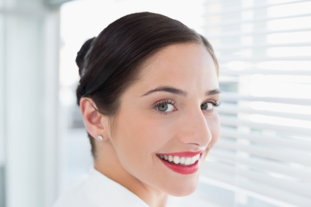 Close-up portrait of a smiling young business womanの写真素材