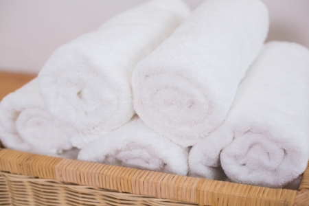 Close up of clean rolled white towelsの写真素材