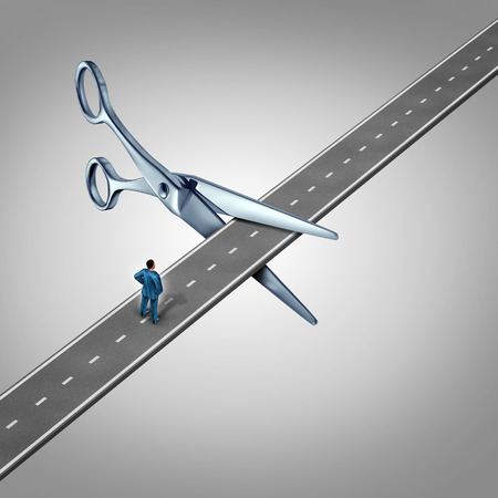 Work interruption concept and interrupted career path as a businessman on a road that is being cut by scissors as a layoff metaphor and symbol for job and employment limits or cutting benefits and opportunity for promotion or advancement. Work interruption concept and interrupted career path as a businessman on a road that is being cut by scissors as a layoff metaphor and symbol for job and employment limits or cutting benefits and opportunity for promotion or advancement.