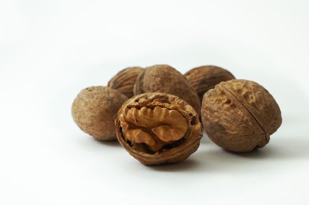 Open walnuts on white background