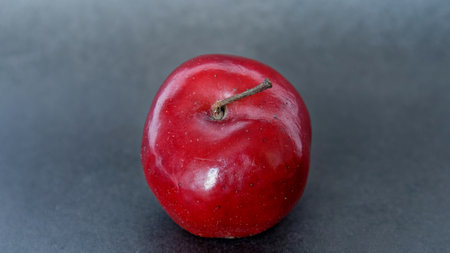 red apple on a gray background