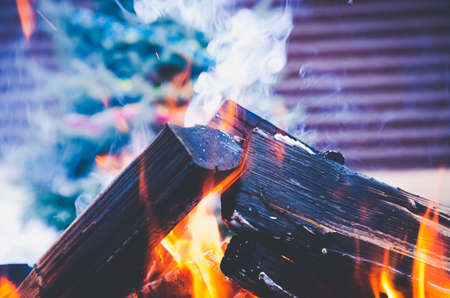 logs engulfed in flames bright background