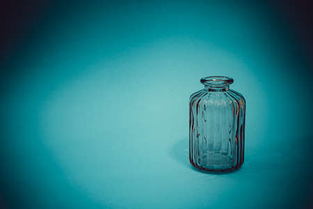 textured glass vase on a blue background
