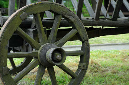 an old wooden cart is standing in the yard