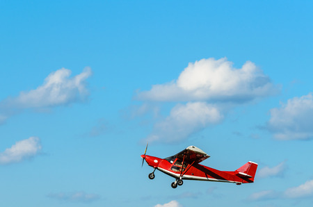 Small sport plane in air