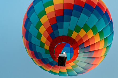 Colored hot air balloon flying in the blue skyのeditorial素材