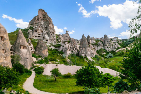 Natural fortress of Uchisar, riddled with man-made dwellings and dovecotes, dominates the skyline of Cappadocia.のeditorial素材