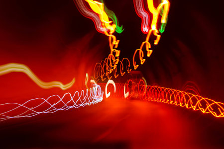 Lights in the dark tunnel while drivingの写真素材