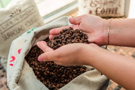White bag full of beans roasted coffeeの写真素材