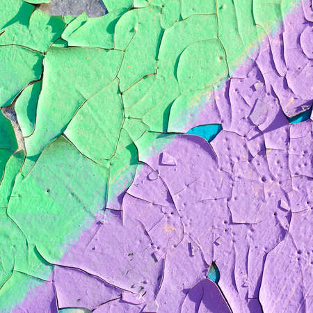 Colorful painted wall with peeling paint, cracks on the wall, square formatの写真素材