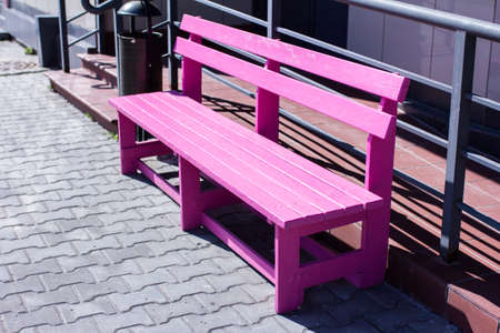 Pink painted bench in the city, bright benchの写真素材