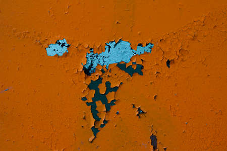 Texture of peeling orange paint macro
