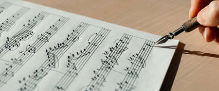 Music notes macro background, handwritten notes, selective focusの写真素材