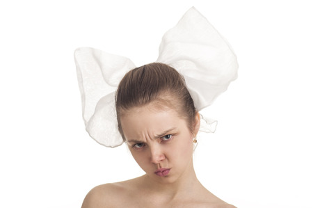 Studio portrait. Emotional girl with hair on white background. Emotions when posing. Studio shot on white background.の写真素材