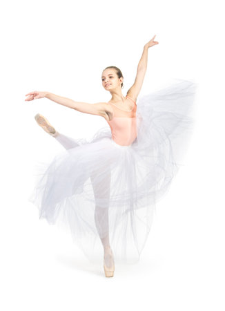 Young,smiling girl dancing the ballet. Studio shot of ballet on a white background. The isolated image.の写真素材