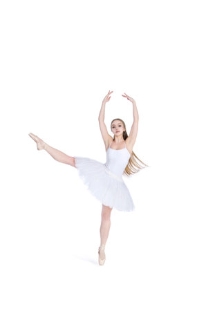 A girl with long hair, in a white tutu dancing ballet. Studio shot on white background , isolated image.の写真素材