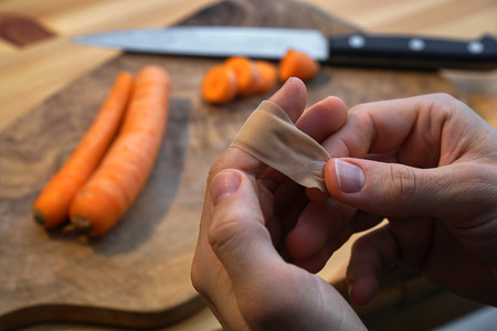 injured in the kitchen while cookingの写真素材