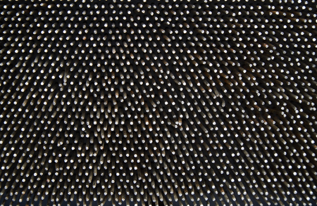 Dark worn rusty metal nails texture background close up
