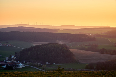 Landscape in the golden hour with hills and mountains slightly toned.の写真素材