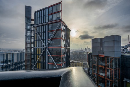 London cityscape against the sun while sunset.