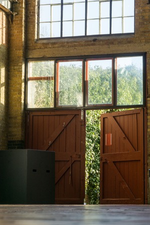 Doors from an old redecorated light factory building with light trailsの写真素材