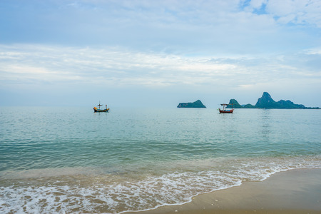 Beautiful scenic of the Ao Thai sea with the boat and islands in the background.の写真素材