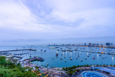 Speedboat parking with beautiful cityscape scenic at Pattaya bay in Thailandの写真素材