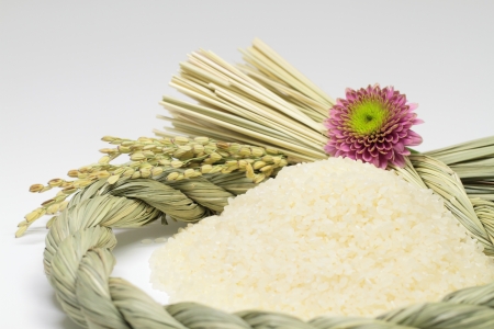 Polished rice and Shinto straw festoon decorationの写真素材