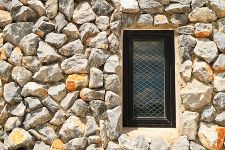 window and rock wallの写真素材