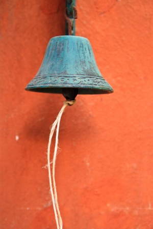 old bell  on yellow background の写真素材
