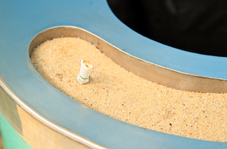 Detail of  Cigarette in sand ashtray binの写真素材