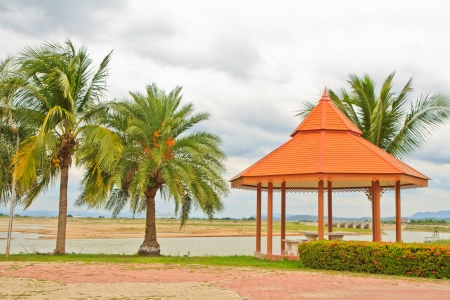 Oriental mediation stand on the middle of an public garden lakeの写真素材