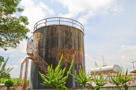 Oil black tank with blue skyの写真素材