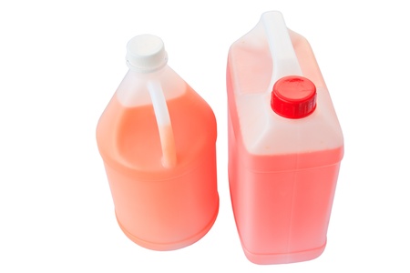gallon bottle of orange and red liquid isolated over a white background