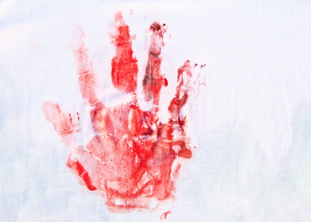 Close up of red hand painted on white T-shirt  backgroundの写真素材