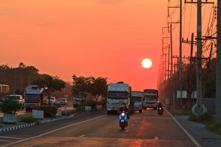 main road and cars against the sunsetのeditorial素材