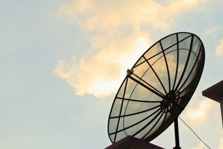 Silhouette satellite dish with sky on roofの写真素材