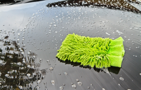 Green cloth over the car for washingの写真素材
