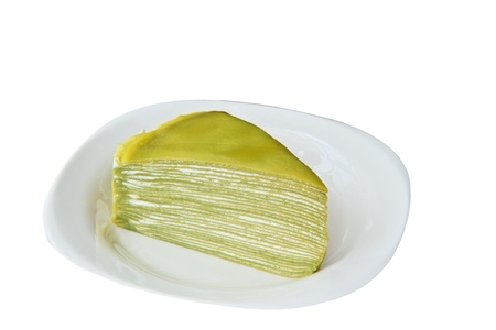 Close up green fresh cake on white dishの写真素材