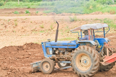 Tractor moving dirt or soil, landscapingの写真素材