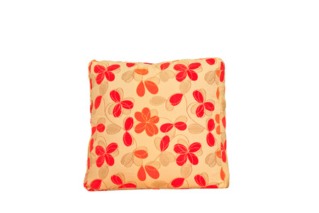 Yellow and red flowers shape pillow isolated on white backgroundの写真素材