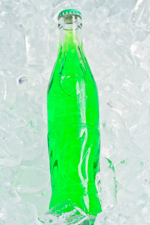 Close up green soft drink on ice back groundの写真素材