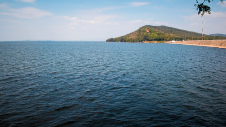 Lake with mountain and fall colors in the backgroundの写真素材