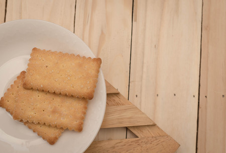 Cookies on a white plate. on wooden table.の写真素材