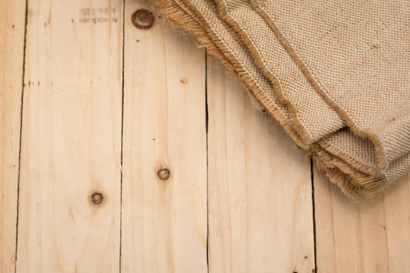 sackcloth on a wooden backgroundの写真素材