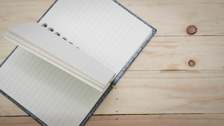 Face sketchbook on wood for background and textの写真素材