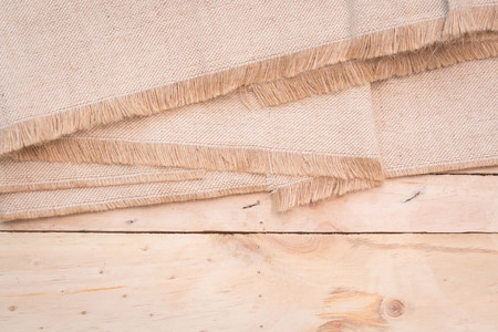 fabric texture brown on pine wood backgroundの写真素材